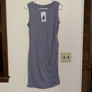 Grey, sleeveless tee shirt style dress with side runching.